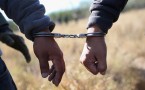 Illegal cross-border immigrant was handcuffed after being caught by  U.S. Border Patrol.